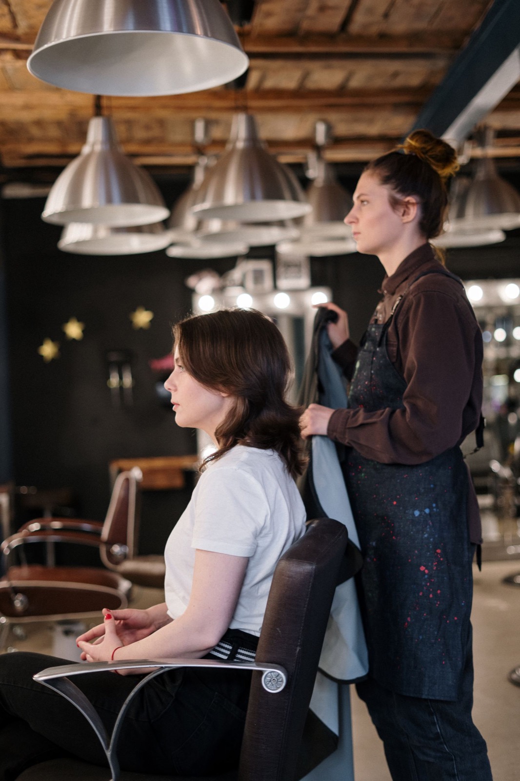 Client receiving professional hair styling at a salon